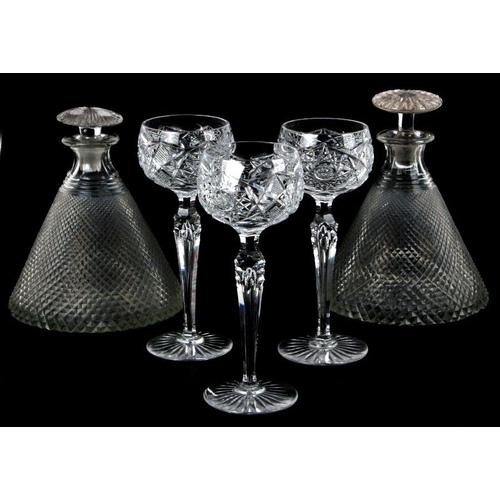 97 - A set of three cut glass hock glasses, 19cms high; together with two cut glass ship's decanters, 19c... 