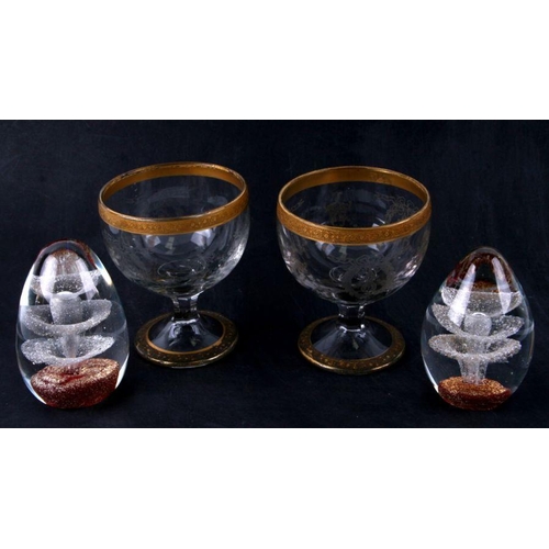 98 - A pair of etched glass bowls with gilded decoration, 14cms high; together with two Art glass paperwe... 