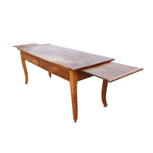 984 - A continental fruitwood farmhouse kitchen table with two frieze drawers and extension draw-leaves, 1... 