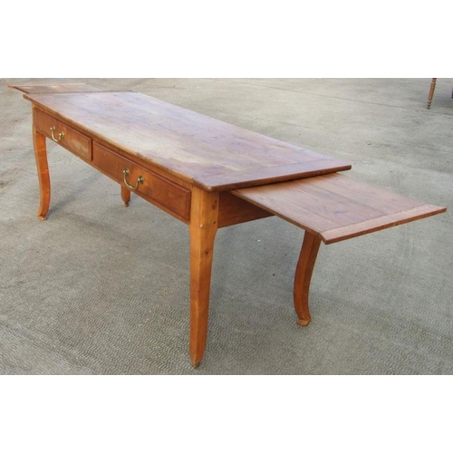 984 - A continental fruitwood farmhouse kitchen table with two frieze drawers and extension draw-leaves, 1... 