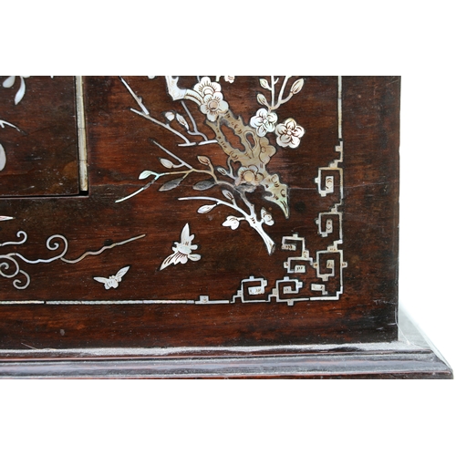 803 - A late 19th century Chinese hardwood & mother of pearl inlaid stationery box, the lift-up lid enclos... 