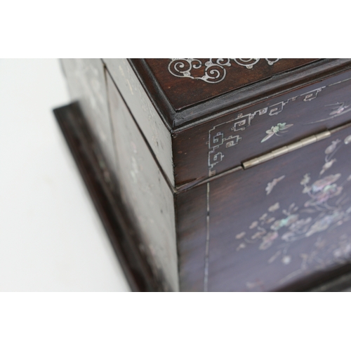 803 - A late 19th century Chinese hardwood & mother of pearl inlaid stationery box, the lift-up lid enclos... 