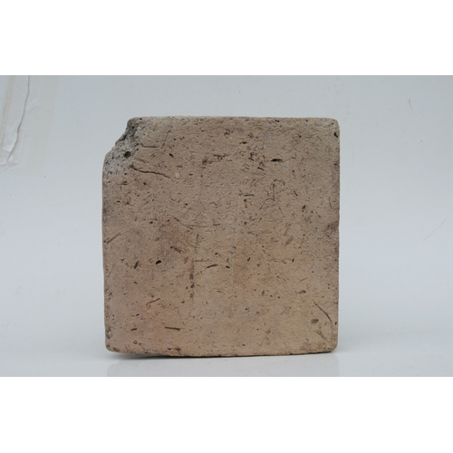 190 - A Babylonian cuneiform inscribed brick, with an impressed rectangle having rows of faintly inscribed... 