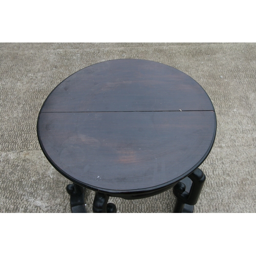 847 - A Chinese hardwood circular table, possibly Zitan, 57cms diameter.