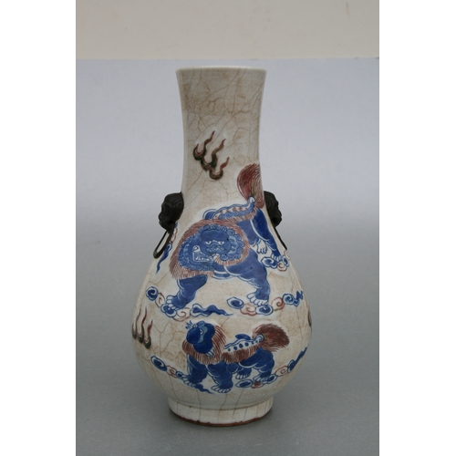 732 - A Chinese crackleware two-handled baluster vase decorated with shi shi, 26cms high.Condition Reportg... 