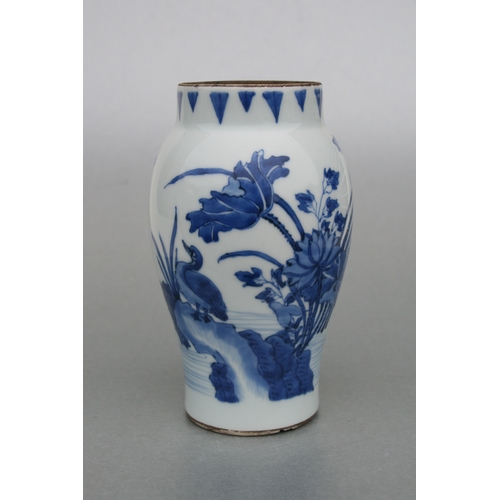 829 - A Chinese blue & white tankard decorated with a river landscape scene with dragon handle, 14cms high... 