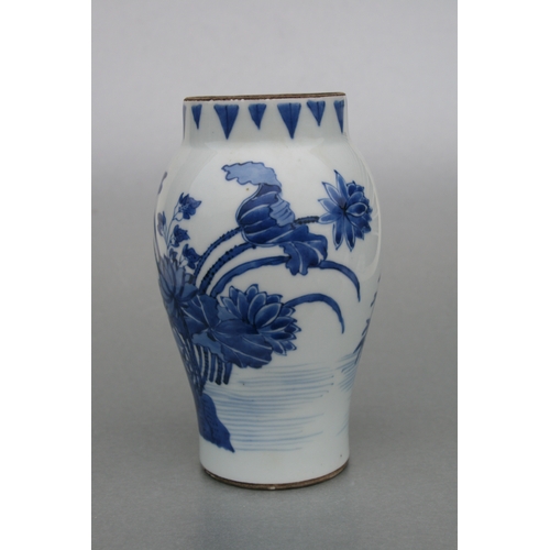 829 - A Chinese blue & white tankard decorated with a river landscape scene with dragon handle, 14cms high... 