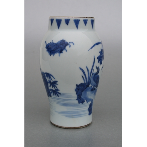 829 - A Chinese blue & white tankard decorated with a river landscape scene with dragon handle, 14cms high... 