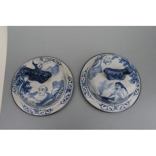 816 - A large pair of Chinese blue & white vases and covers decorated with figures and with fo dog finials... 