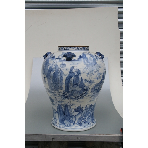 816 - A large pair of Chinese blue & white vases and covers decorated with figures and with fo dog finials... 