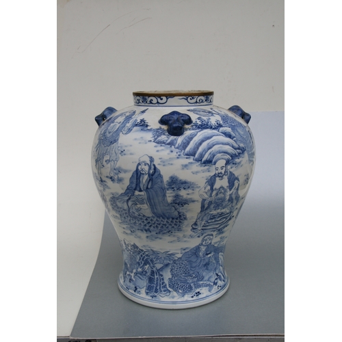 816 - A large pair of Chinese blue & white vases and covers decorated with figures and with fo dog finials... 