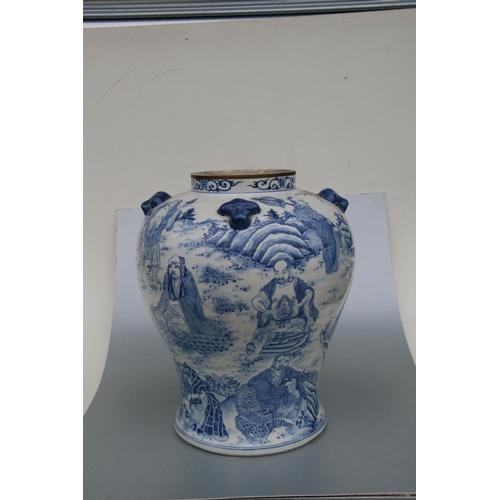 816 - A large pair of Chinese blue & white vases and covers decorated with figures and with fo dog finials... 