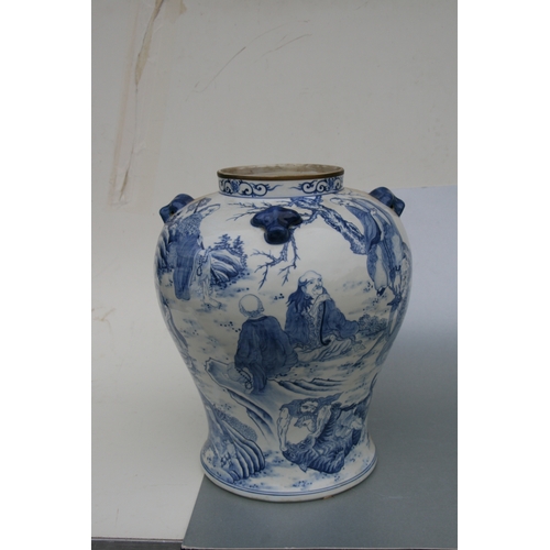 816 - A large pair of Chinese blue & white vases and covers decorated with figures and with fo dog finials... 