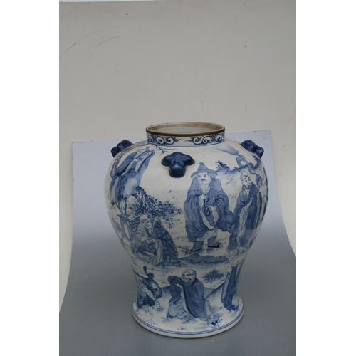 816 - A large pair of Chinese blue & white vases and covers decorated with figures and with fo dog finials... 