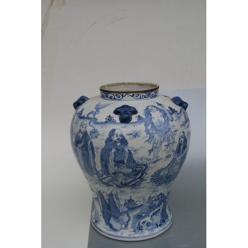 816 - A large pair of Chinese blue & white vases and covers decorated with figures and with fo dog finials... 