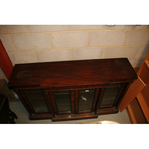 991 - A late Regency mahogany breakfront bookcase in the manner of Gillows, with a pair of central glazed ... 