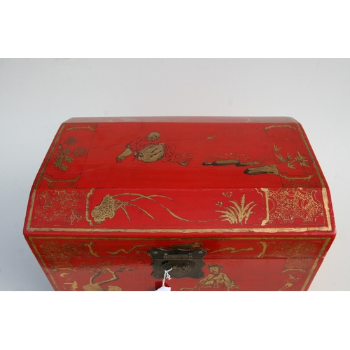 775 - A Chinese red lacquer box and cover decorated with gilt figures within a landscape, 45cms wide.