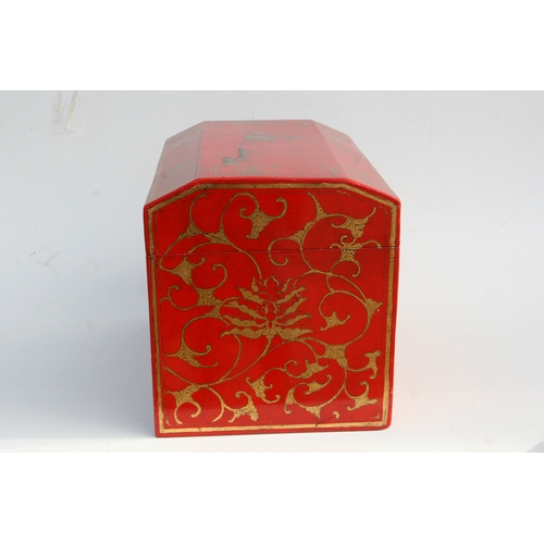 775 - A Chinese red lacquer box and cover decorated with gilt figures within a landscape, 45cms wide.