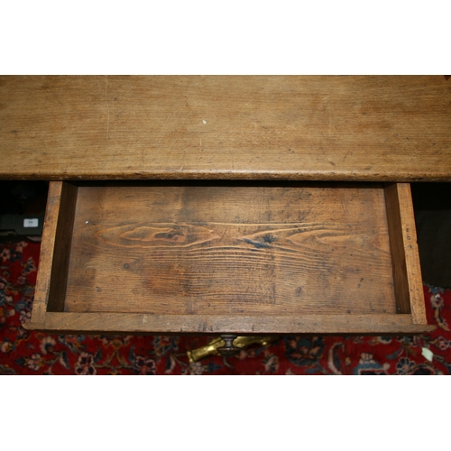 898 - A continental fruitwood farmhouse table with three plank top, single frieze drawer and turned legs, ... 