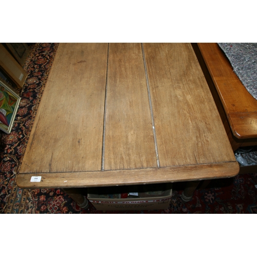 898 - A continental fruitwood farmhouse table with three plank top, single frieze drawer and turned legs, ... 