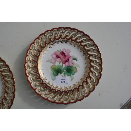 132 - A pair of mid 19th century Coalport botanical plates , the rims pierced with a series of S-shaped ho... 