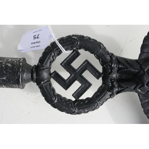 75 - A WWII German Third Reich style cast metal insignia, 25cms wide, mounted on a metal spike (believed ... 