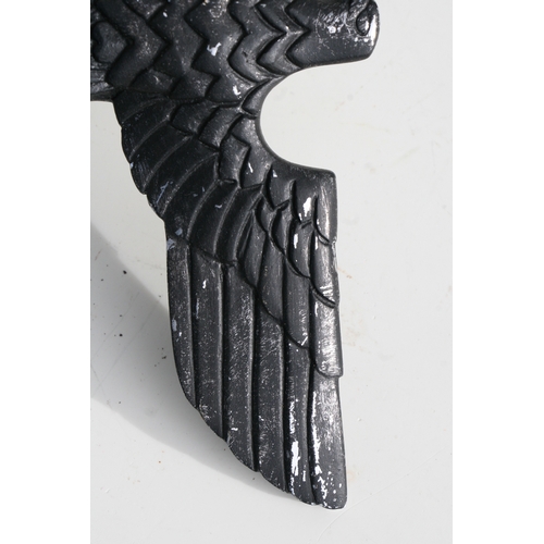 75 - A WWII German Third Reich style cast metal insignia, 25cms wide, mounted on a metal spike (believed ... 