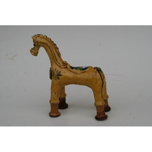 805 - A Turkish Canakkale pottery figure of a stylised horse, 24cms high.