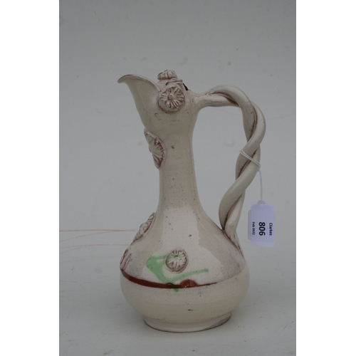 806 - A Turkish Canakkale pottery ewer, 22cms high.