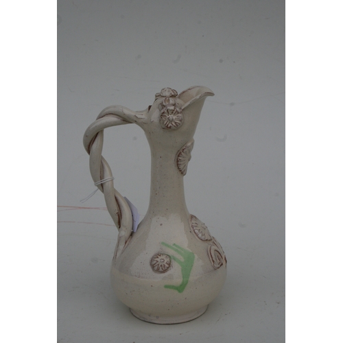 806 - A Turkish Canakkale pottery ewer, 22cms high.