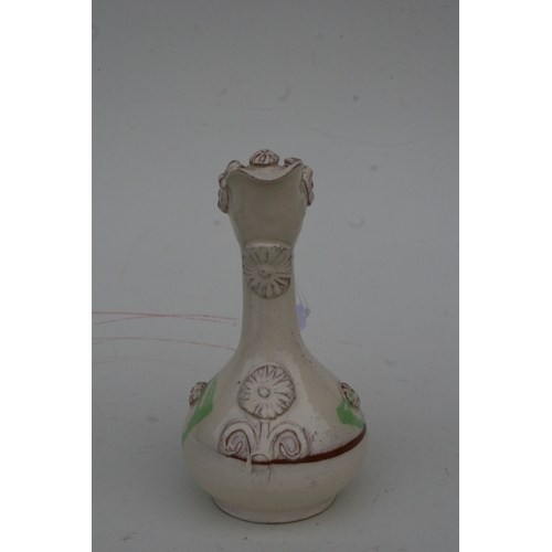 806 - A Turkish Canakkale pottery ewer, 22cms high.