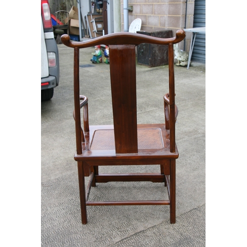 850 - A Chinese hardwood 'Official's Hat' chair with rattan seat.