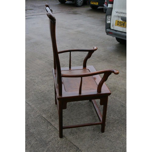 850 - A Chinese hardwood 'Official's Hat' chair with rattan seat.