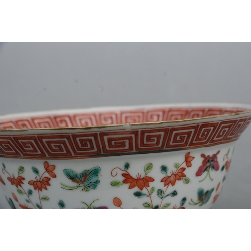 853 - A Chinese famille rose bowl decorated with flowers and butterflies, red seal mark to the underside, ... 