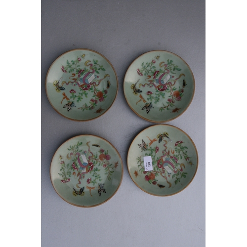 841 - A quantity of Chinese Canton Export plates decorated with butterflies, flowers and insects on a cela... 