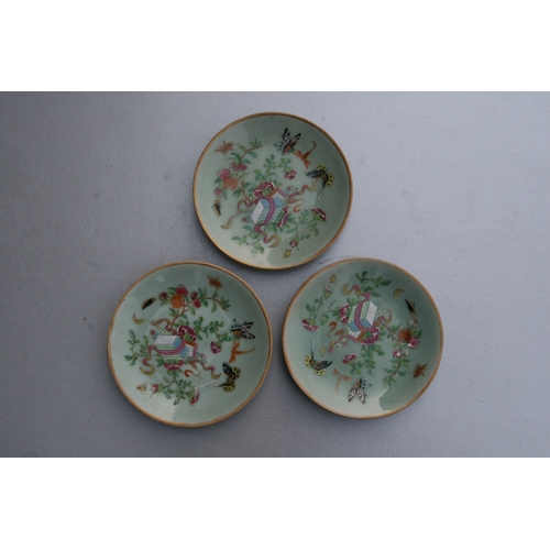 841 - A quantity of Chinese Canton Export plates decorated with butterflies, flowers and insects on a cela... 