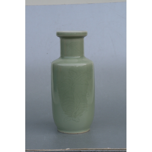 851 - A Chinese celadon glaze vase decorated with foliage and fruit, 24cms high (drilled).