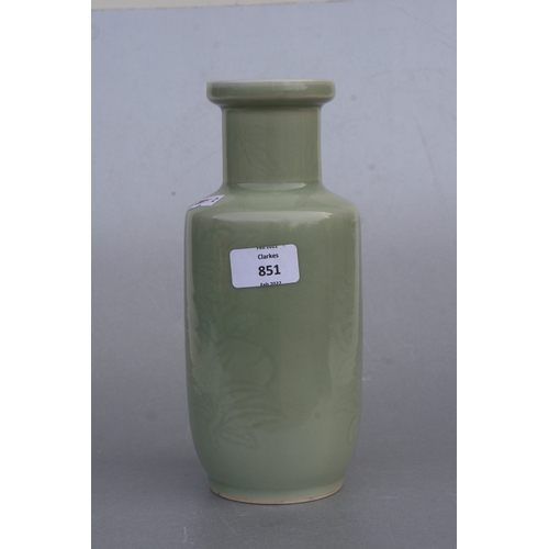 851 - A Chinese celadon glaze vase decorated with foliage and fruit, 24cms high (drilled).