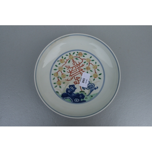 845 - A Chinese Ducai shallow footed bowl, blue six character mark to the underside, 21cms diameter.