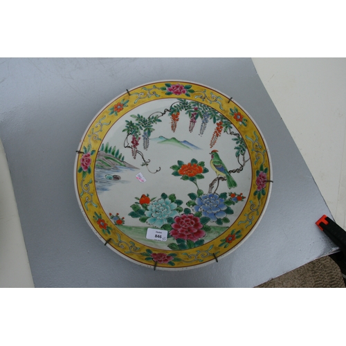 846 - A Chinese famille vert charger decorated with a scrolling dragon, 42cms diameter; together with a Ch... 