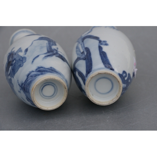 836 - A pair of Chinese blue & white baluster vases decorated with figures in a garden, blue four characte... 