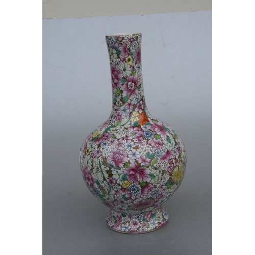 839 - A Chinese millefiori bottle vase with red seal mark to the underside, 33cms high.