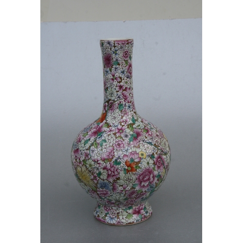 839 - A Chinese millefiori bottle vase with red seal mark to the underside, 33cms high.