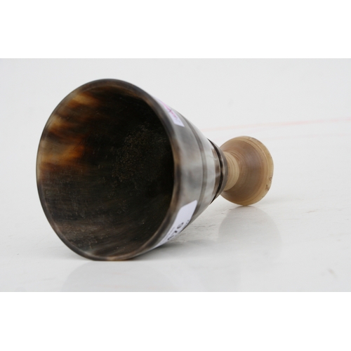 476 - A buffalo horn goblet with rhino horn stem, 14cms high.