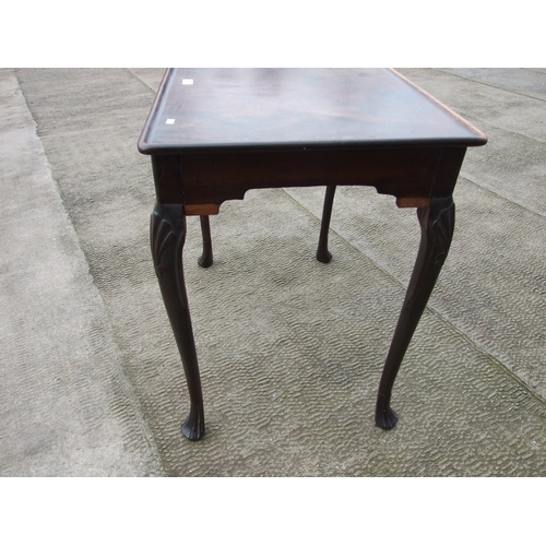 950 - A George III mahogany silver table with dished rectangular top above a shaped apron, on shell capped... 