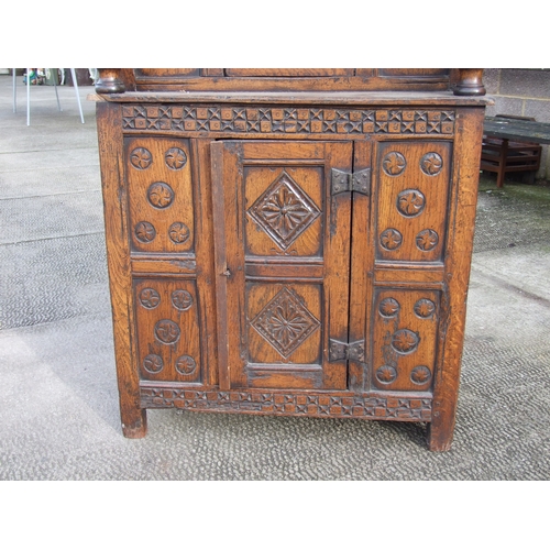 1019 - A 17th century style carved oak court cupboard of small proportions, 70cms wide.