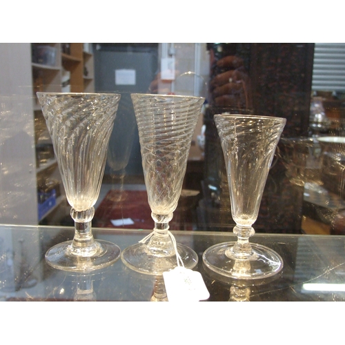 107 - A quantity of 19th century wrythen ale glasses, the largest 13cms high (12).