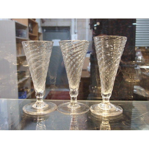 107 - A quantity of 19th century wrythen ale glasses, the largest 13cms high (12).