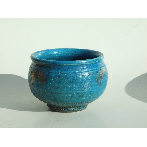 142 - A Studio pottery footed bowl with turquoise glazed decoration, impressed Studio mark to base, 14cms ... 