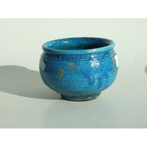 142 - A Studio pottery footed bowl with turquoise glazed decoration, impressed Studio mark to base, 14cms ... 